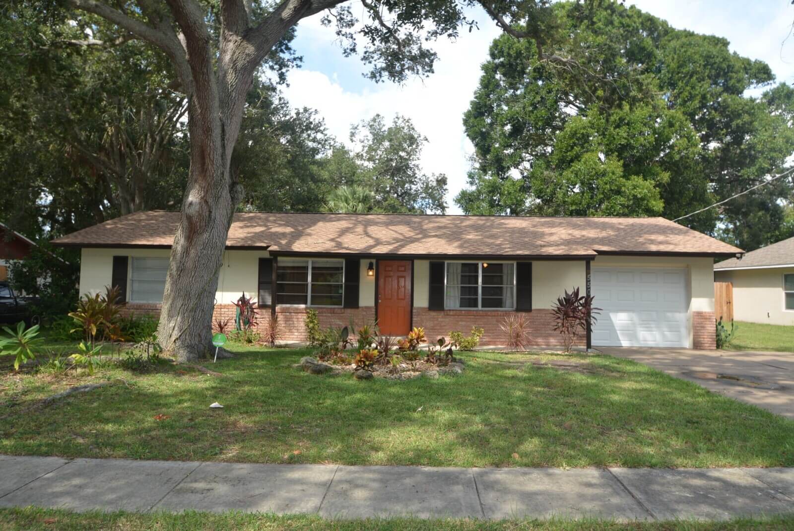 Single-story house with brown roof and garage.